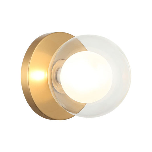 Matteo Lighting Solaris WX33001AG wall sconce in Aged Gold Brass with opal and clear glass